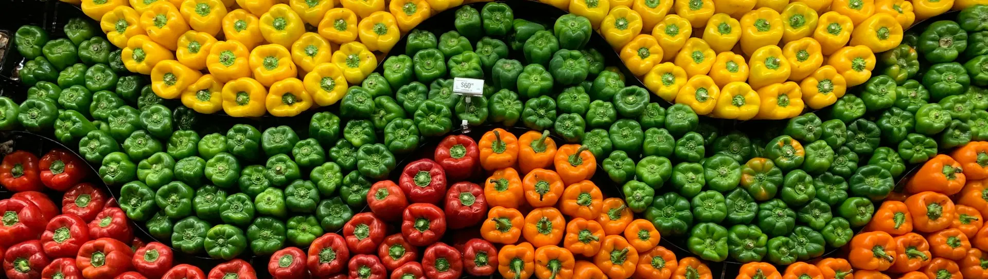green and red fruits on black plastic crate
